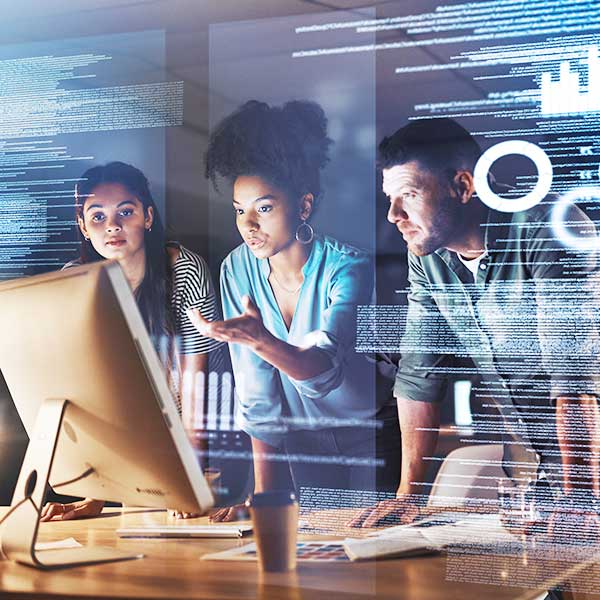 group of programmers working together on a computer